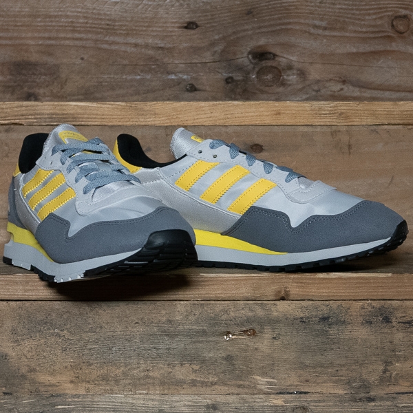 grey and yellow adidas trainers
